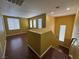 Inviting living room with stylish wood floors and staircase featuring plenty of natural light at 5846 Lee Fairy Ct, Las Vegas, NV 89139
