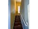 Staircase with hardwood steps and handrail with natural lighting at 5846 Lee Fairy Ct, Las Vegas, NV 89139