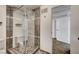 Modern bathroom features a tiled walk-in shower with glass door and designer tile work at 619 D Avenue, Boulder City, NV 89005