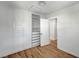 Bedroom features built-in closet and drawer system, wood floor and ample storage at 619 D Avenue, Boulder City, NV 89005