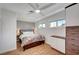 Cozy bedroom with a ceiling fan, natural light, and a built-in dresser at 619 D Avenue, Boulder City, NV 89005