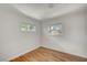 Bedroom with hardwood floors and dual windows providing natural light and neighborhood views at 619 D Avenue, Boulder City, NV 89005