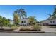 Well-maintained single story home showcasing charming landscaping, driveway and mature trees at 619 D Avenue, Boulder City, NV 89005