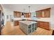 Spacious kitchen featuring ample cabinetry, modern appliances, and a large island with wine rack for entertaining at 619 D Avenue, Boulder City, NV 89005