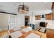 Modern kitchen with island, stainless steel appliances, and stylish lighting fixtures at 619 D Avenue, Boulder City, NV 89005