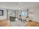 Spacious living room with a fireplace, hardwood floors, large windows, and comfortable seating for a cozy ambiance at 619 D Avenue, Boulder City, NV 89005