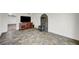 Open living room with unique flooring, a decorative fireplace, and tv at 619 D Avenue, Boulder City, NV 89005
