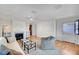 Bright living room featuring a fireplace, neutral furniture, hardwood floors, and ample natural light at 619 D Avenue, Boulder City, NV 89005
