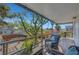 Covered patio with seating overlooking a manicured backyard and a charming pergola at 619 D Avenue, Boulder City, NV 89005