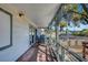 Spacious covered patio with outdoor seating and views of the landscaped backyard and trees at 619 D Avenue, Boulder City, NV 89005