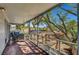 Covered patio with outdoor seating and a view of the landscaped backyard and brick patio at 619 D Avenue, Boulder City, NV 89005