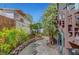 Charming side yard with a walking path, lush plantings, and a cozy ambiance at 619 D Avenue, Boulder City, NV 89005