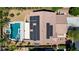 Aerial view showcases a home with solar panels, a pool, and desert landscaping at 6489 Crest Estates St, Las Vegas, NV 89131