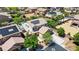 Aerial view of a two-story home featuring a three-car garage and solar panels on the roof at 6489 Crest Estates St, Las Vegas, NV 89131