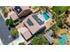An aerial view showcases the home's pool, spa, solar panels, and landscaped backyard at 6489 Crest Estates St, Las Vegas, NV 89131