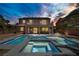 Resort-style backyard featuring a pristine pool, spa, and a covered patio for relaxing at 6489 Crest Estates St, Las Vegas, NV 89131