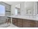 Bright bathroom features a double sink vanity, sleek fixtures, and a modern design at 6489 Crest Estates St, Las Vegas, NV 89131