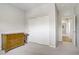 A bedroom with neutral carpet and paint, closet with sliding doors and traditional style furniture at 6489 Crest Estates St, Las Vegas, NV 89131