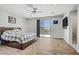 Bedroom showcasing hardwood floors, sliding glass door with patio access, and ceiling fan at 6489 Crest Estates St, Las Vegas, NV 89131