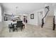 Bright dining area with tile floors, staircase, and contemporary chandelier at 6489 Crest Estates St, Las Vegas, NV 89131