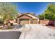 Charming two-story home with a stone accent façade and attached three-car garage at 6489 Crest Estates St, Las Vegas, NV 89131