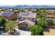 Charming two-story home with a well-maintained lawn, mature trees, and a spacious three-car garage at 6489 Crest Estates St, Las Vegas, NV 89131