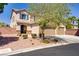 Beautiful two-story home with a three-car garage, desert landscaping, and inviting curb appeal at 6489 Crest Estates St, Las Vegas, NV 89131