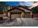 Charming two-story home showcasing a stone accent façade and attached three-car garage at 6489 Crest Estates St, Las Vegas, NV 89131
