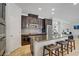 Modern kitchen featuring an island with seating and stainless steel appliances at 6489 Crest Estates St, Las Vegas, NV 89131