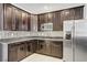 Updated kitchen features granite countertops, stainless steel appliances, and mosaic tile backsplash at 6489 Crest Estates St, Las Vegas, NV 89131