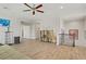 Spacious living room with wood floors, ceiling fan, and plenty of room for entertaining at 6489 Crest Estates St, Las Vegas, NV 89131