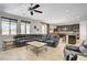 Open living room with ceiling fan and view of kitchen and dining area at 6489 Crest Estates St, Las Vegas, NV 89131