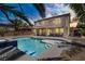 Backyard view of private pool and spa complemented by a covered patio and desert landscaping at 6489 Crest Estates St, Las Vegas, NV 89131