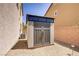 Durable shed in backyard with double door and transom windows provides additional storage at 6489 Crest Estates St, Las Vegas, NV 89131
