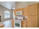 Bright kitchen with a gas range, ample cabinet space, and a casual dining area at 6617 Lavender Lilly Ln # 1, North Las Vegas, NV 89084