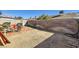 Spacious backyard with a brick patio, perfect for outdoor entertaining and relaxation at 7047 Mountain Meadow Ln, Las Vegas, NV 89147
