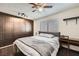 Bedroom featuring built-in closet, ceiling fan, and dark wood floors at 7047 Mountain Meadow Ln, Las Vegas, NV 89147