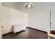 Spare bedroom featuring dark wood floors and a white dresser at 7047 Mountain Meadow Ln, Las Vegas, NV 89147