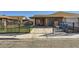 Charming single-story home featuring a gated front yard and covered parking at 7047 Mountain Meadow Ln, Las Vegas, NV 89147