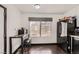 Compact eat-in kitchen featuring a breakfast table, a large window, and black appliances at 7047 Mountain Meadow Ln, Las Vegas, NV 89147