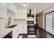 Updated kitchen featuring white cabinets and countertops, along with stainless steel appliances at 7047 Mountain Meadow Ln, Las Vegas, NV 89147