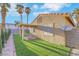Backyard featuring low-maintenance artificial turf, tasteful rock landscaping, and privacy walls at 7909 Smokey Ridge Ct, Las Vegas, NV 89131