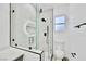 Modern bathroom features a glass-enclosed shower and white fixtures at 7909 Smokey Ridge Ct, Las Vegas, NV 89131