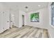 Bright bedroom features wood-look floors and natural light from the window at 7909 Smokey Ridge Ct, Las Vegas, NV 89131