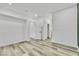 Bright bedroom with wood-look flooring, recessed lights, and an open closet at 7909 Smokey Ridge Ct, Las Vegas, NV 89131
