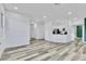 Spacious living room featuring modern flooring, crisp white walls and lots of natural light at 7909 Smokey Ridge Ct, Las Vegas, NV 89131