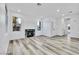 Bright living room with hardwood floors, fireplace, and large windows at 7909 Smokey Ridge Ct, Las Vegas, NV 89131