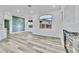 Open concept living room with hardwood floors, fireplace, and accent wall at 7909 Smokey Ridge Ct, Las Vegas, NV 89131