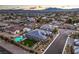Beautiful aerial shot of a backyard with a pool, spa, and well-maintained landscaping at 8445 S Tenaya Way, Las Vegas, NV 89113