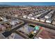 Extensive aerial view of a Primary-planned community with multiple homes and neighborhood streets at 8445 S Tenaya Way, Las Vegas, NV 89113